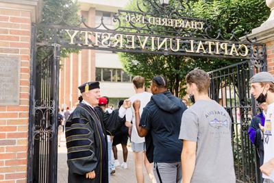 President 考夫曼 Welcoming Students Through The Gate